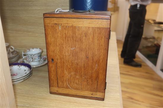 A cased brass microscope